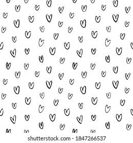 Vector seamless heart pattern. Valentine's Day black paint ornament. Hand drawn abstract seamless background with small and simple hearts. Black and white vector wallpaper. Wrapping paper, gift, print