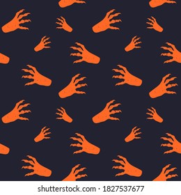 Vector seamless horror patterns for Helloween. Scary witch or zombie hands with long nails. Orange silhouette on black background.