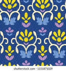 Vector seamless ikat pattern with floral ornaments. Ttaditional ethnic fabric texture.