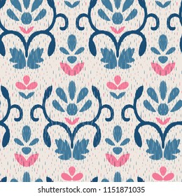 Vector seamless ikat pattern with floral ornaments. Ttaditional ethnic fabric texture.