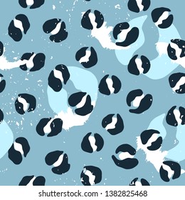 Vector seamless leopard pattern. Abstract black and white spots on blue background. Modern design