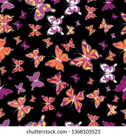 Vector. Seamless multicolored background with flying moths. Seamless background from bright butterflies. Beautiful colorful butterflies chaotically fly on black, purple and orange colors.