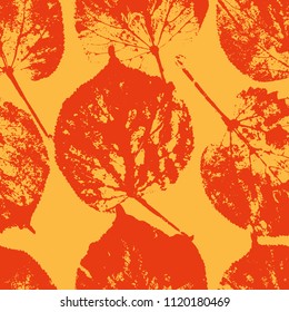 Vector seamless with orange autumn leaves on yellow background.