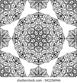 Vector seamless ornament of a black contour on a white background. East pattern of ornamental mandalas. The template for the carpet, textile, shawl.