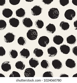 Vector seamless pattern. Abstract background with round brush strokes. Monochrome hand drawn texture. Stylish polka dot