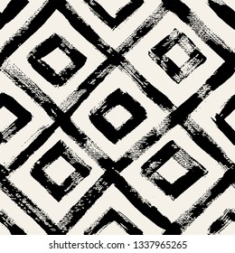 Vector seamless pattern. Abstract background with diamonds or squares. Bold textured brush strokes. Monochrome hand drawn texture. Hipster graphic design.