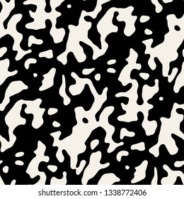 Vector seamless pattern. Abstract background with rough spots. Monochrome noisy texture. Randomly disposed sloppy organic streaks.