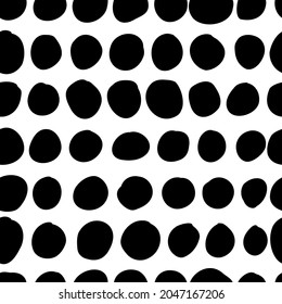 Vector seamless pattern. Abstract background with round brush strokes. Monochrome hand drawn texture. Stylish polka dot