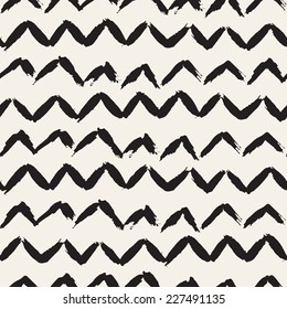 Vector seamless pattern. Abstract background with zigzag brush strokes. Monochrome hand drawn texture