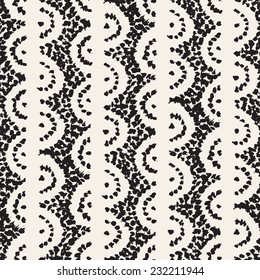 Vector seamless pattern. Abstract background with dotted semicircles made with brush strokes. Monochrome hand drawn texture. Handmade pattern is made from small specks