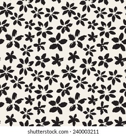 Vector seamless pattern. Abstract background with flowers made with brush strokes. Monochrome hand drawn texture. Artistic tileable theme with flowers