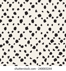 Vector seamless pattern. Abstract background with rhombuses. Small spots of brush strokes forming geometric ornament. Monochrome hand drawn texture