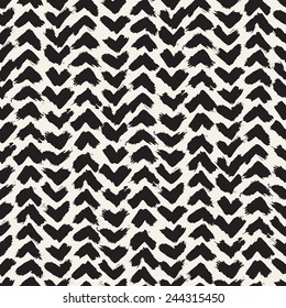 Vector seamless pattern. Abstract background with brush strokes. Monochrome hand drawn texture with chevron