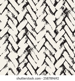 Vector seamless pattern. Abstract background with brush strokes. Monochrome hand drawn texture with herringbone or chevron. Modern graphic design.