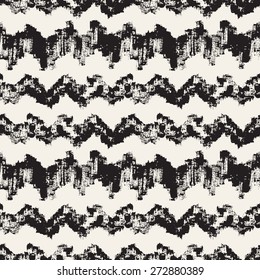 Vector seamless pattern. Abstract background with zigzag brush strokes. Monochrome hand drawn texture. Hipster graphic design.