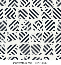 Vector seamless pattern. Abstract geometric background with grunge texture. Tiles with striped pattern