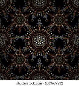Vector seamless pattern with abstract hand drawn brown, orange and green snowflakes design on a black background. Hand painted pattern.