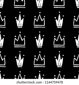 Vector seamless pattern with abstract hand drawn silhouettes of crowns
