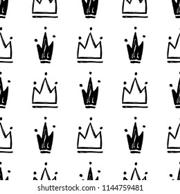 Vector seamless pattern with abstract hand drawn silhouettes of crowns