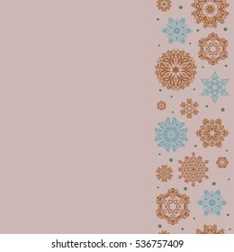 Vector seamless pattern with abstract hand drawn snowflakes design on a neutral background. Vertical hand painted pattern with copy space (place for your text).