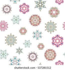 Vector seamless pattern with abstract hand drawn neutral, green and blue snowflakes design on a white background. Hand painted pattern.