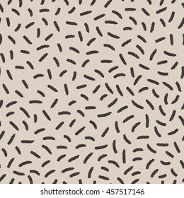 Vector seamless pattern. Abstract little hatches on beige background