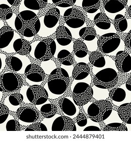 Vector seamless pattern. Abstract natural texture. Bold monochrome ovals. Creative background with rounded elements. Decorative black and white spotted design.