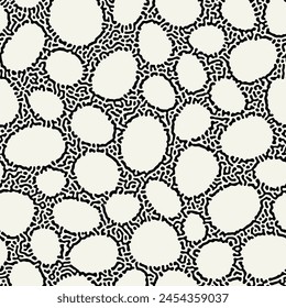 Vector seamless pattern. Abstract natural texture. Bold monochrome ovals. Creative background with rounded elements. Decorative black and white spotted design.