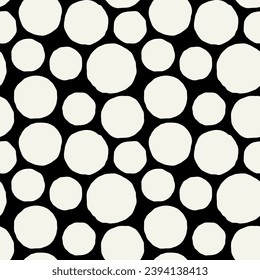 Vector seamless pattern. Abstract spotty texture. Natural monochrome design. Creative background with rough circles. Decorative creative swatch. Simple hand drawn polka dots.