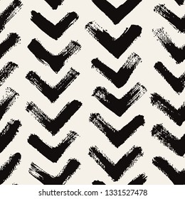 Vector seamless pattern. Abstract textured background with zigzag brush strokes. Monochrome hand drawn print with chevron design.