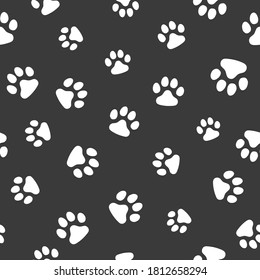 Vector, seamless pattern. Abstraction, white traces of paws of a cat, dog on a dark gray background. For prints, packaging, social media, web.