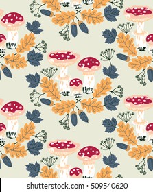 Vector seamless pattern with acorns, amanitas and  leaves in autumn colors. Beautiful forest background
