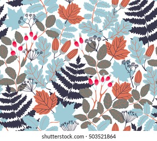 Vector seamless pattern with acorns and leaves and berries of wild rose in autumn colors. Beautiful forest background
