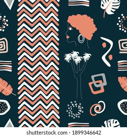 Vector seamless pattern with African and abstract symbols, tropical leaves on a dark background.  Fashionable style.