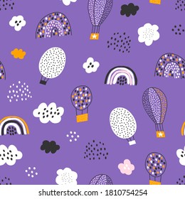 Vector seamless pattern with air balloons, rain, clouds and rainbows. Cute modern texture for fabric, wallpaper, textile, nursery and kindergarten. Vector illustration.