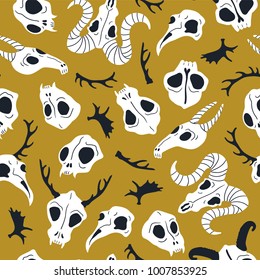 Vector seamless pattern with animal skulls. Halloween or Day of the dead design for fabric with cute skulls and horns.