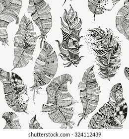Vector seamless pattern of  artistically feathers on a white background. Vintage, tribal, artistically drawn, stylized, feathers