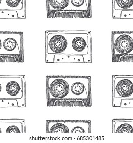 Vector seamless pattern with audio cassettes tape. Hand drawn illustration isolated on white.  Sketch style vintage texture