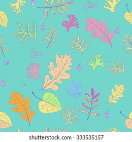 Vector seamless pattern of autumn multi-colored leaves on turquoise background