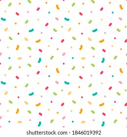 Vector seamless pattern background with bright colorful confetti, sprinkles, dots.