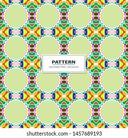 Vector seamless pattern background with different geometrical shapes of multiple colors. Illustration with symmetrical design.