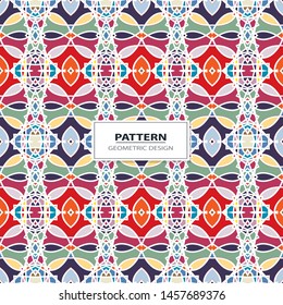 Vector seamless pattern background with different geometrical shapes of multiple colors. Illustration with symmetrical design.