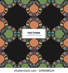 Vector seamless pattern background with different geometrical shapes of multiple colors.