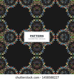 Vector seamless pattern background with different geometrical shapes of multiple colors.