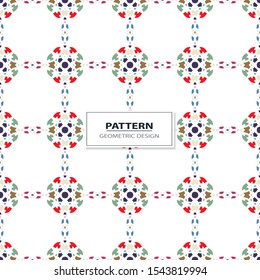 Vector seamless pattern background with different geometrical shapes of multiple colors. Illustration with symmetrical design.