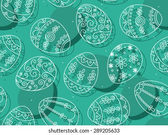 Vector seamless pattern with beautiful carved Easter eggs on blue.