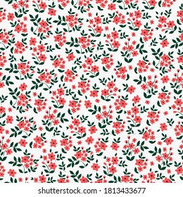 Vector seamless pattern. Beautiful pattern in a small flower. Little red flowers. White background. Ditsy flower background. Elegant template for fashionable prints.