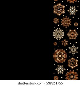 Vector seamless pattern in beige, yellow and brown colors on black background with copy space (place for your text). Snowflakes winter New Year vertical frame.