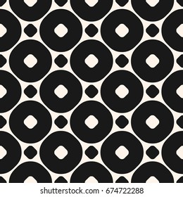 Vector seamless pattern with big circles and rings in staggered grid. Simple modern abstract background. Funky monochrome geometric texture. Black & white design element for prints, decor, textile