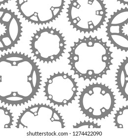 Vector seamless pattern with bike chainrings (chainwheels, sprockets) isolated on white background.
